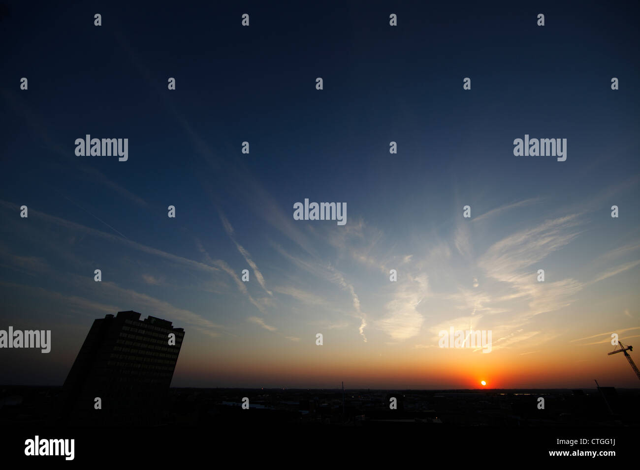 Maze-like contrails around sunset. Stock Photo