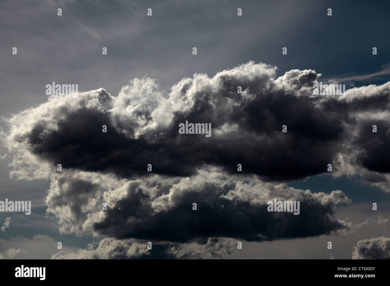Vividly detailed cumulus clouds, with striking cottony edges. Stock Photo