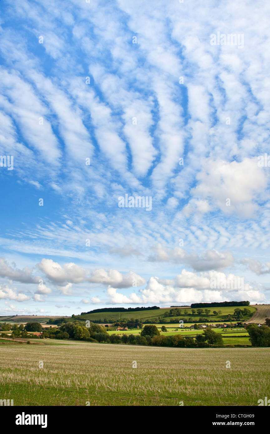 A view of the English countryside with white clouds and blue sky