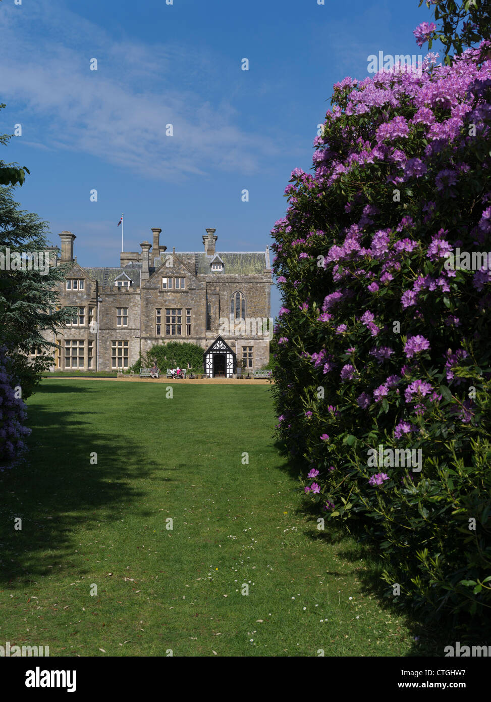 dh Home of Lord Montagu BEAULIEU PALACE HAMPSHIRE UK Stately Mansion house estate english country manor uk garden rhododendron new forest Stock Photo