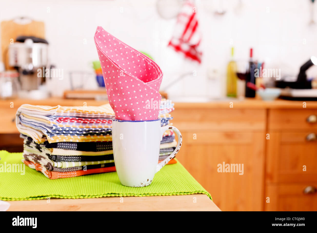 Cloth and a mug on the kitchen table Stock Photo
