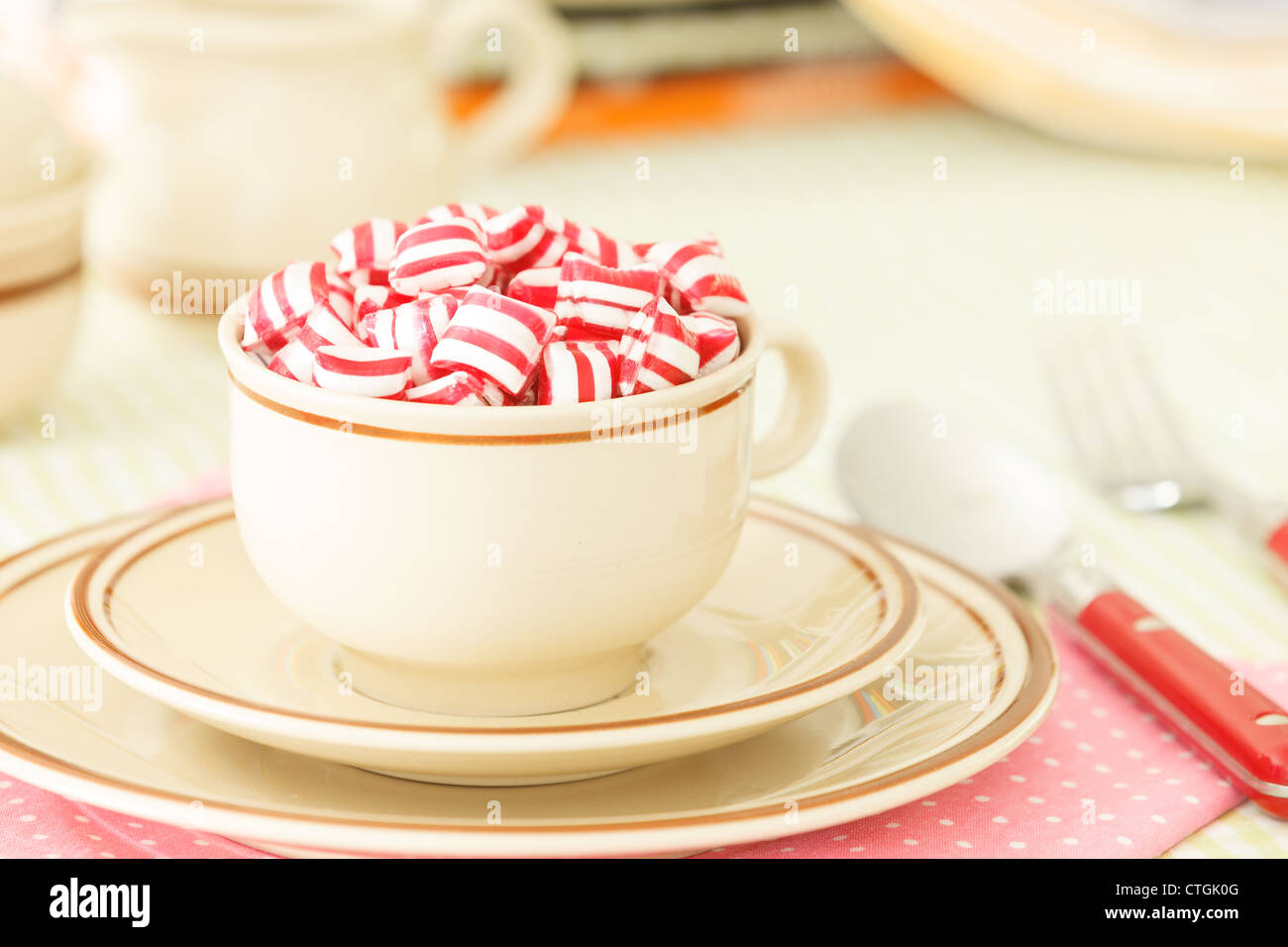 Candies in a teacup on the table Stock Photo