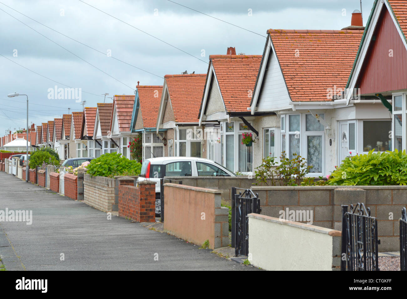 Street of many repetitive similar design bungalows Stock Photo