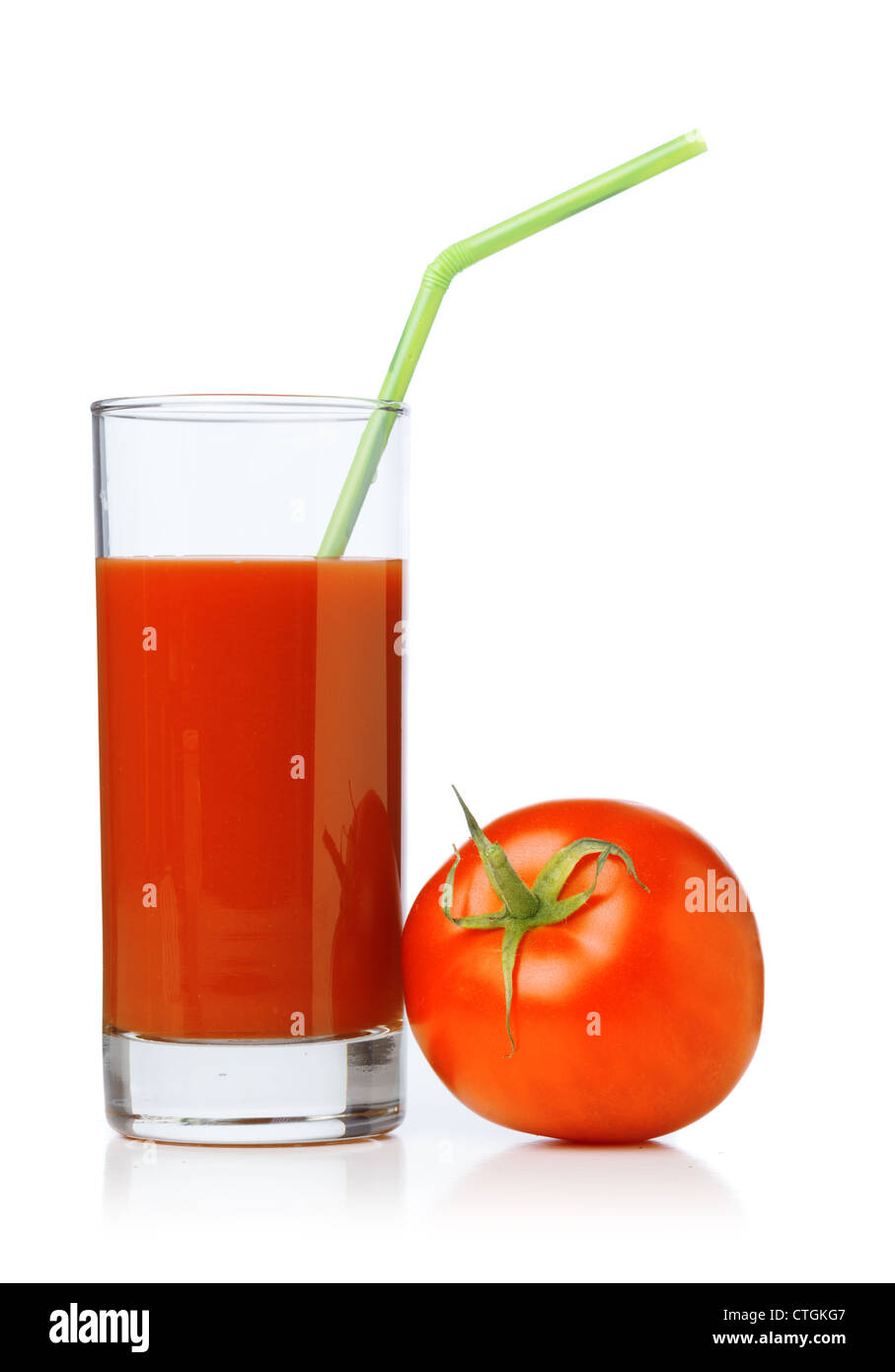 Tomato juices in glass with a straw and tomatoes Stock Photo