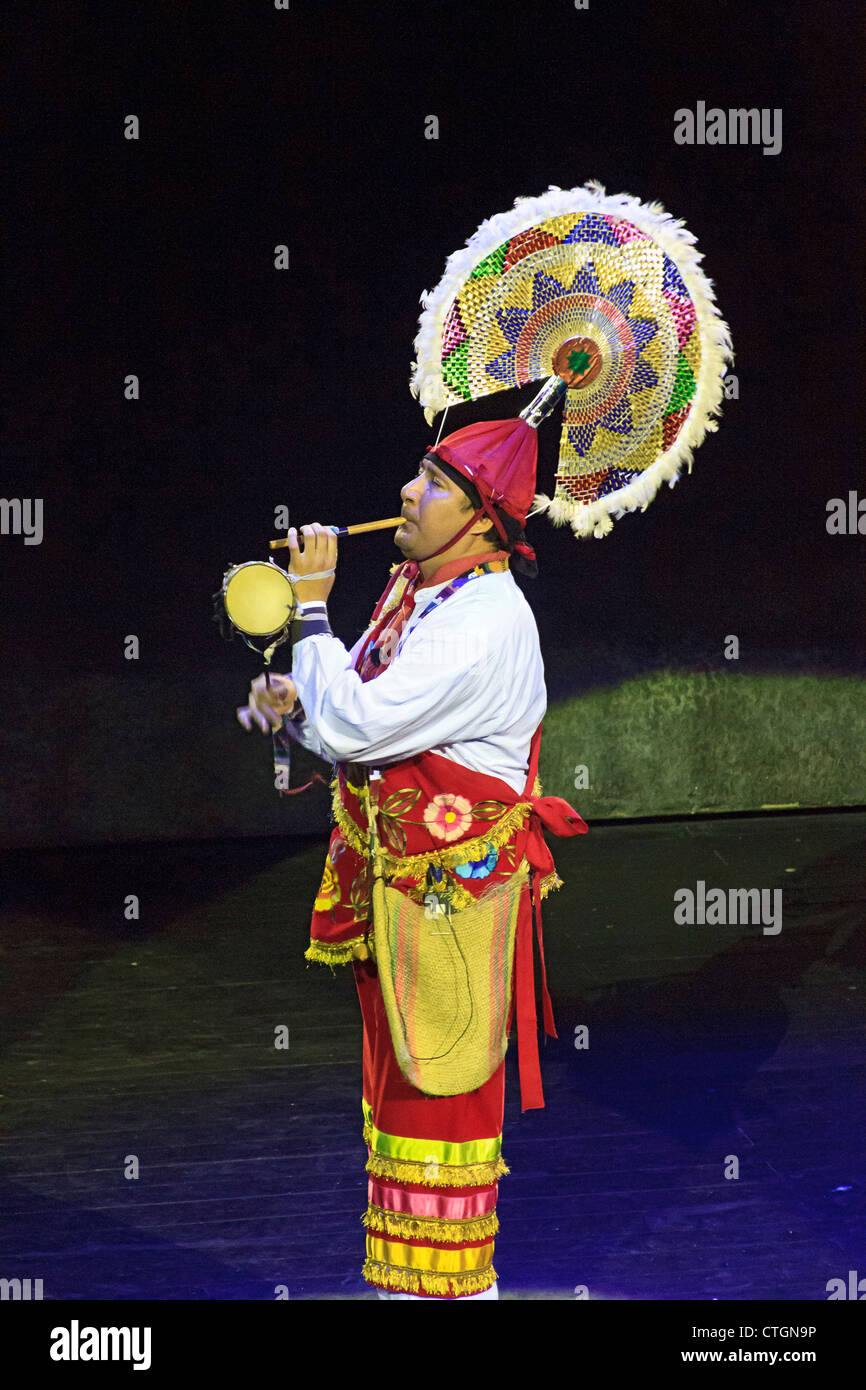 Mexican man plays flute and drum at Xcaret's "Mexico Espectacular" show