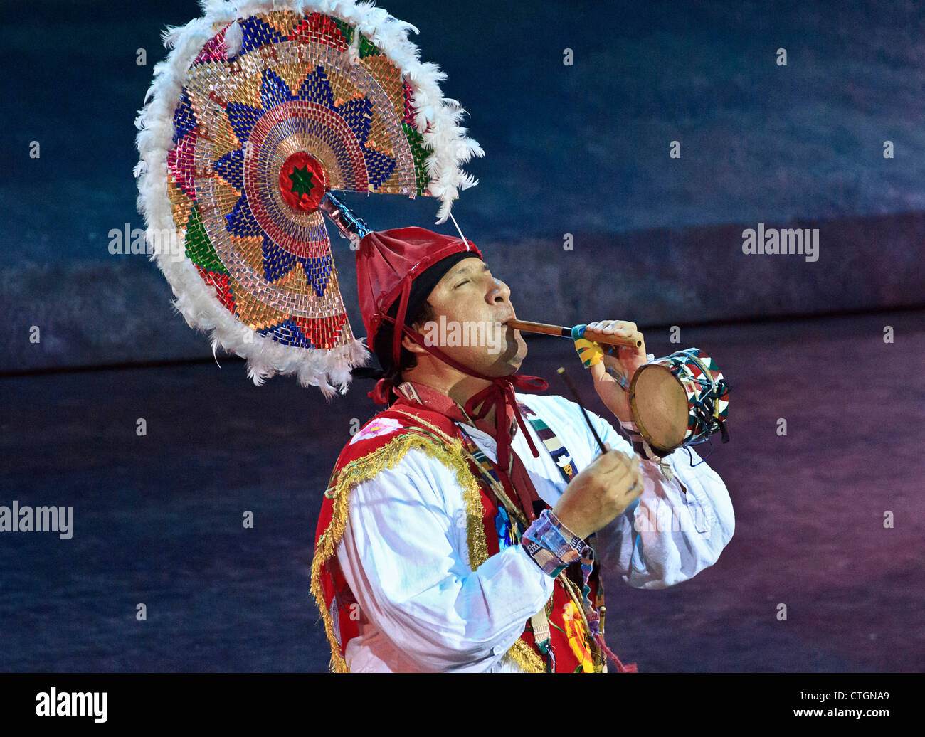 Mexican man plays flute and drum at Xcaret's "Mexico Espectacular" show