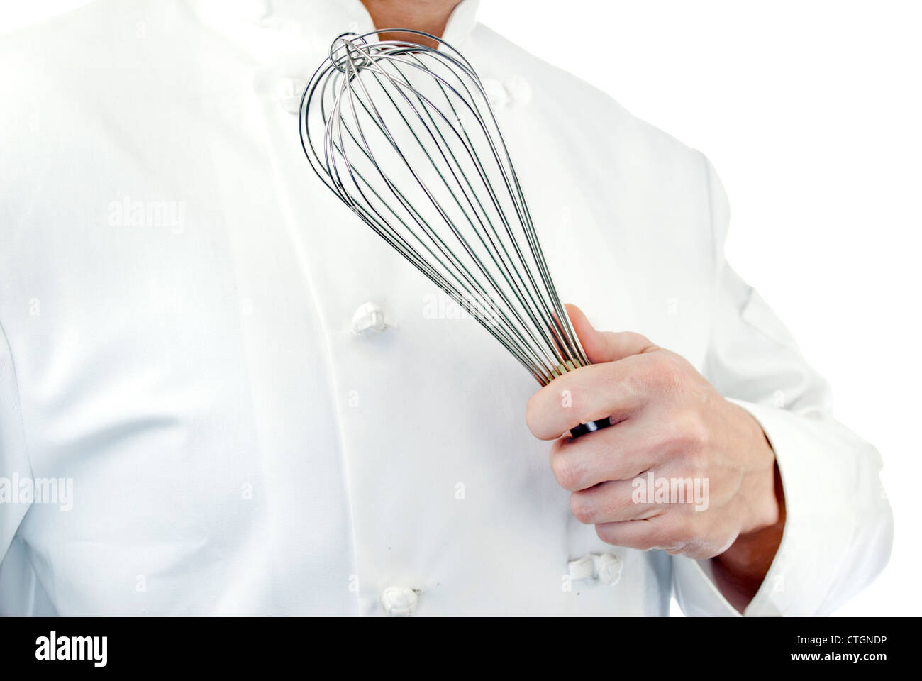 Close-up of a chef holding a whisk; side facing, torso only. Stock Photo
