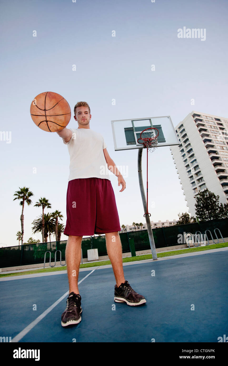 Caucasian man standing on basketball court Stock Photo - Alamy
