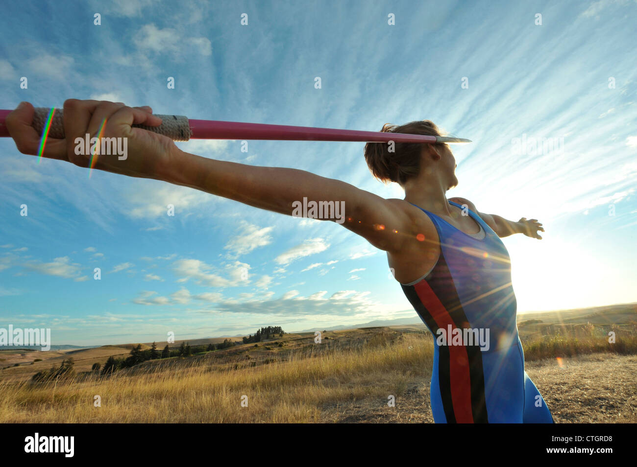 Caucasian athlete aiming javelin Stock Photo