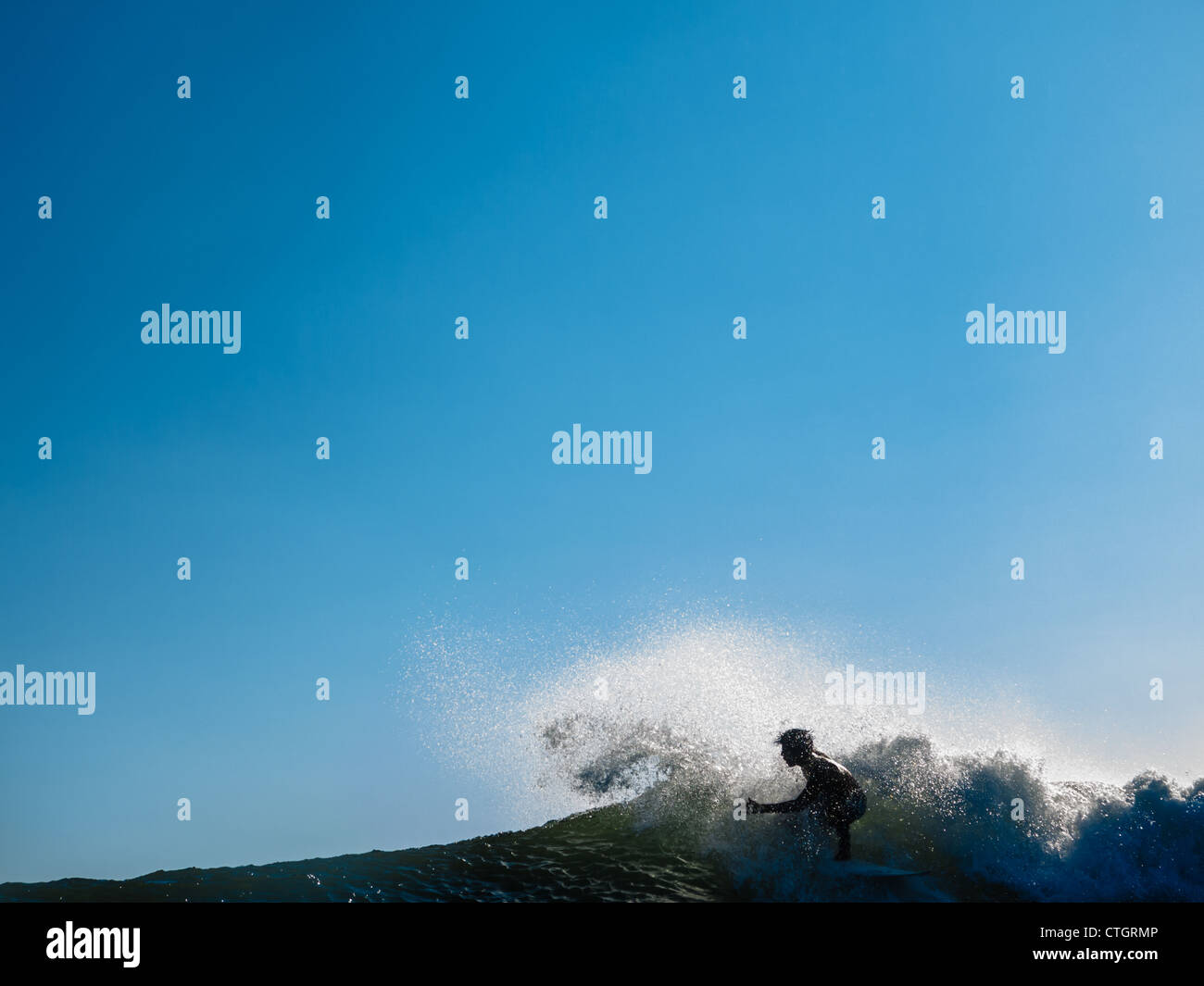 Surfer carves a wave at one of Nicaragua's pacific surfing hot spots PLAYA MADERAS, Stock Photo