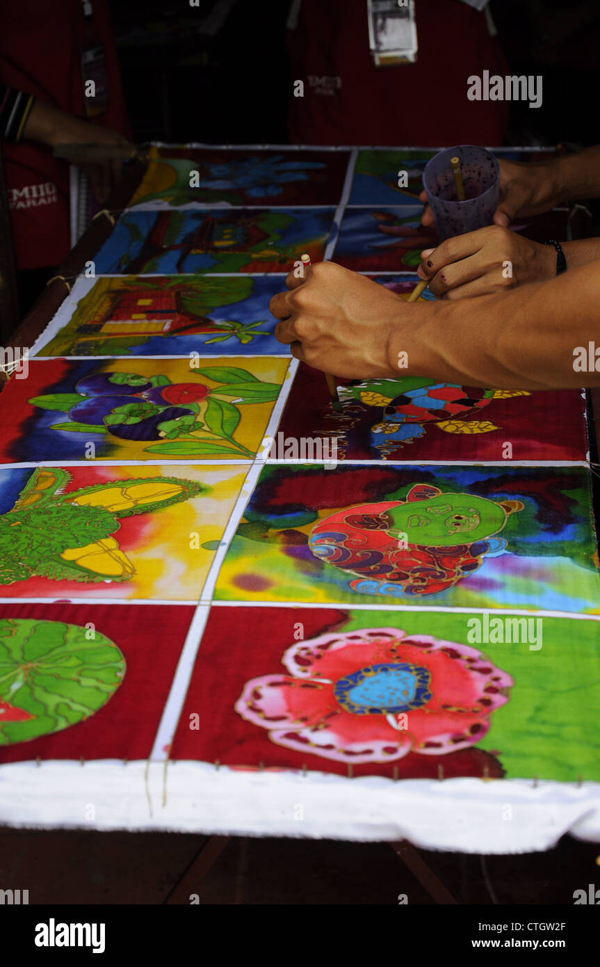 Batik painting work is being carried out at the workshop. This work is done with care to produce high quality batik. Stock Photo