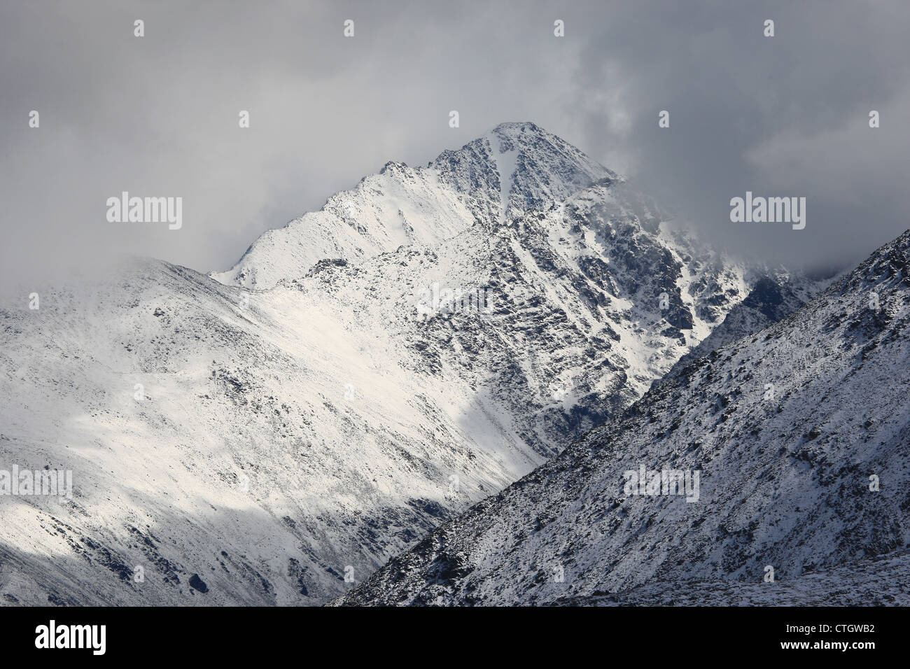 Nothern Chuya mountain ridge, Altai mountains, white silence, cloudy peaks Stock Photo