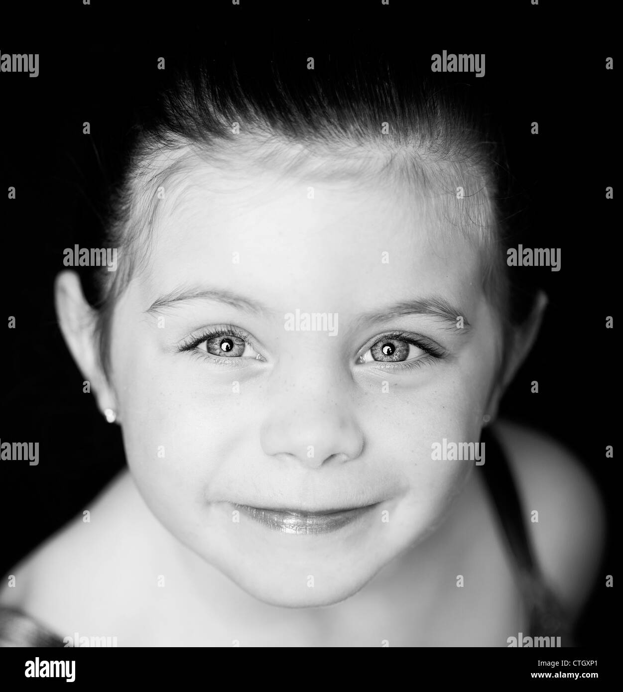 Beautiful close up of a toddler ballerina on black background Stock Photo