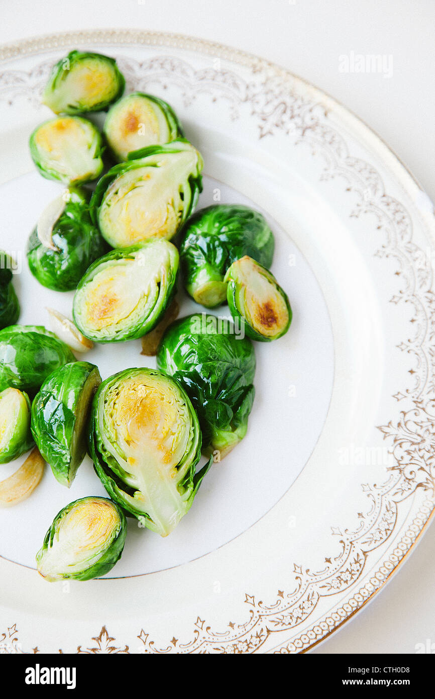 Sliced brussels sprouts on plate Stock Photo