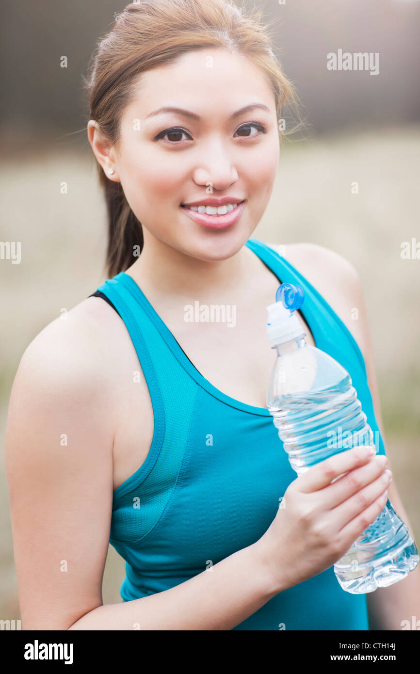 Asian woman drinking water Stock Photo Alamy