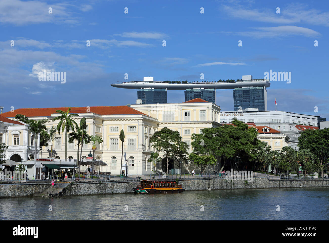 The Asian Civilization Museum building on the Singapore River with the Marina Bays Sands in the background. Stock Photo