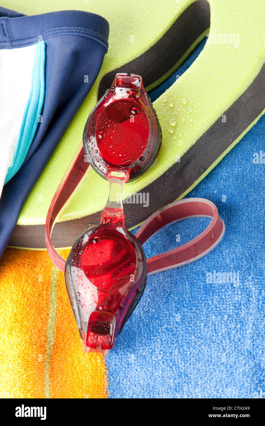 Swimming trunks, goggles and towel Stock Photo Alamy