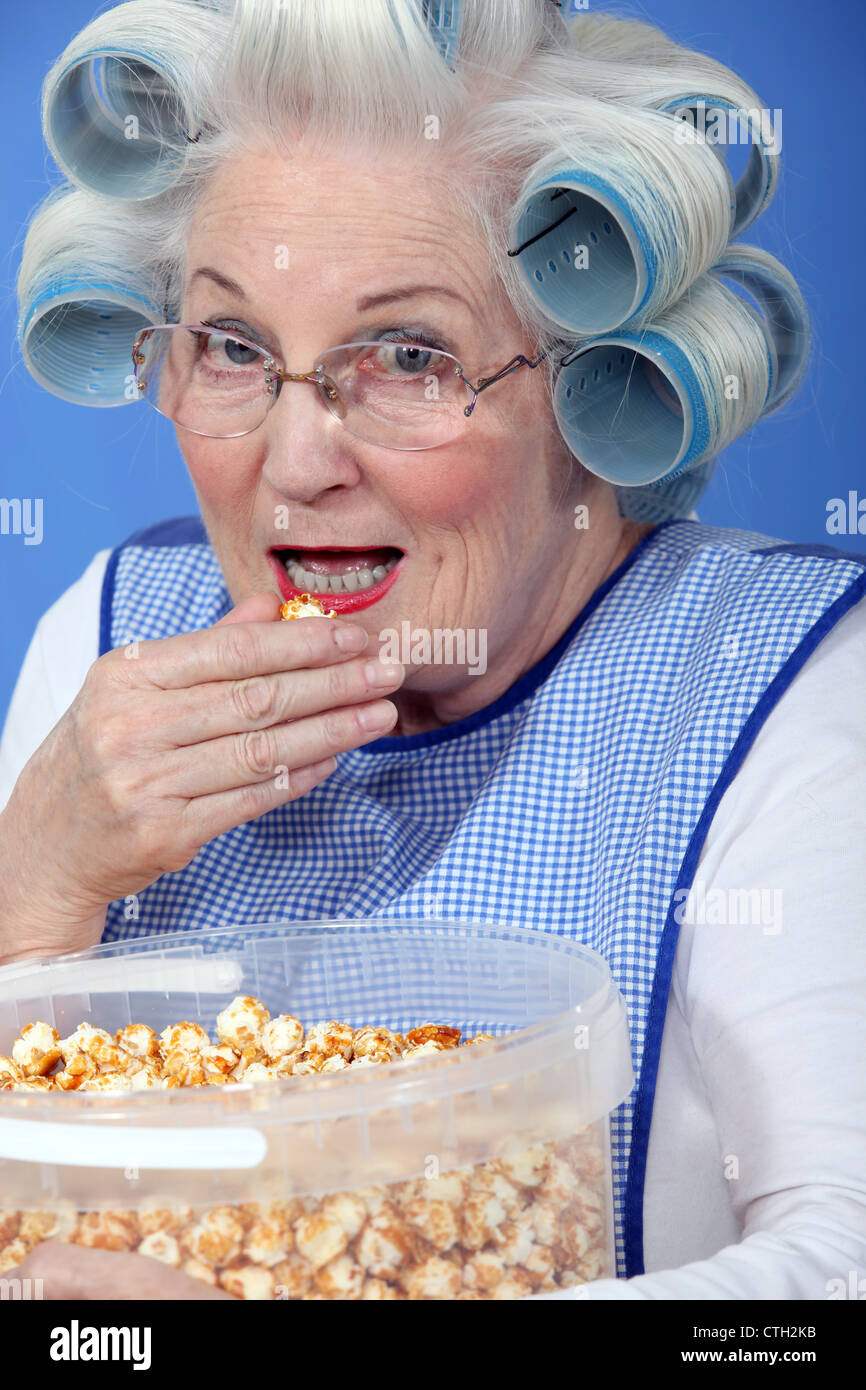 Woman eating popcorn Stock Photo Alamy