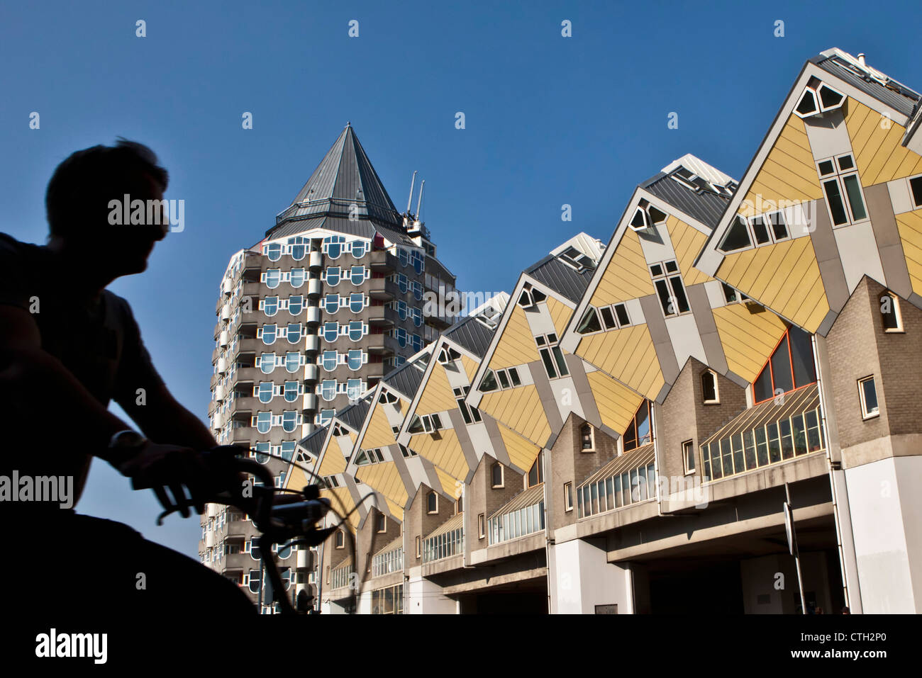The Netherlands, Rotterdam, Cube houses, architect Jan Blom. Cyclist. Stock Photo