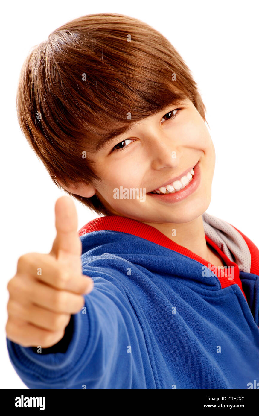 Portrait of young boy showing a thumbs up Stock Photo - Alamy