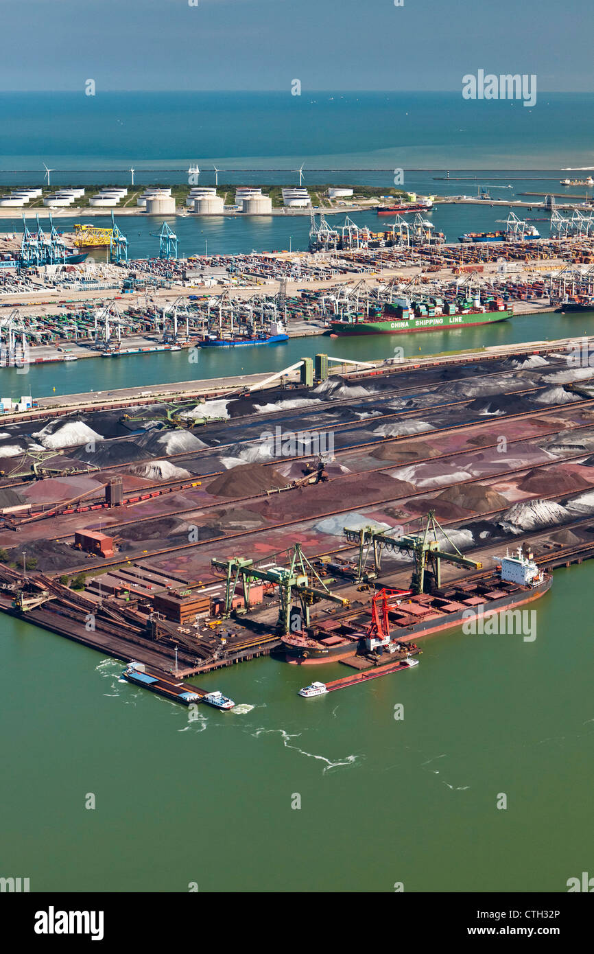 The Netherlands, Rotterdam, Port. Container, ore and oil storage. Aerial. Stock Photo