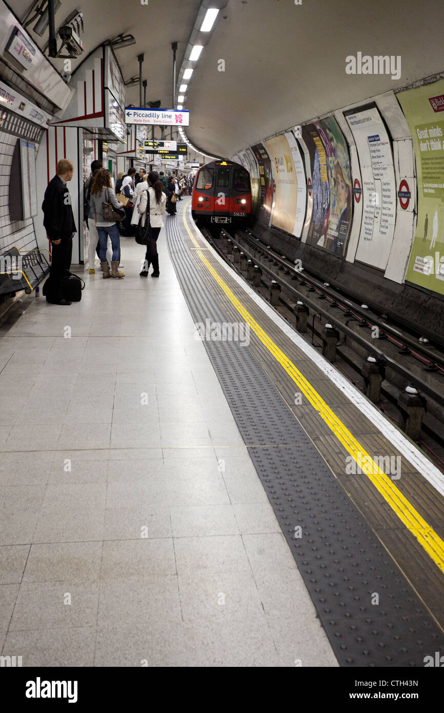 People waiting for train on the platform, Piccadilly Circus Underground
