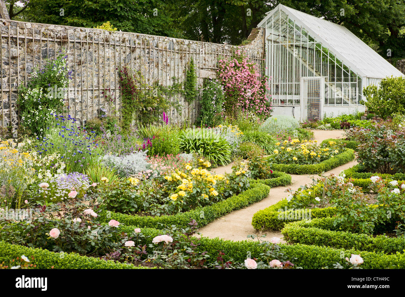 Part of the walled flower garden and glass house La Seigneurie Sark Stock Photo