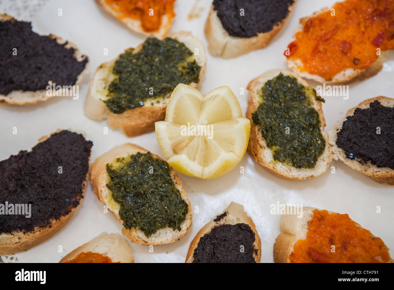 Hors d'oeuvres of bread with pesto and caviar Stock Photo