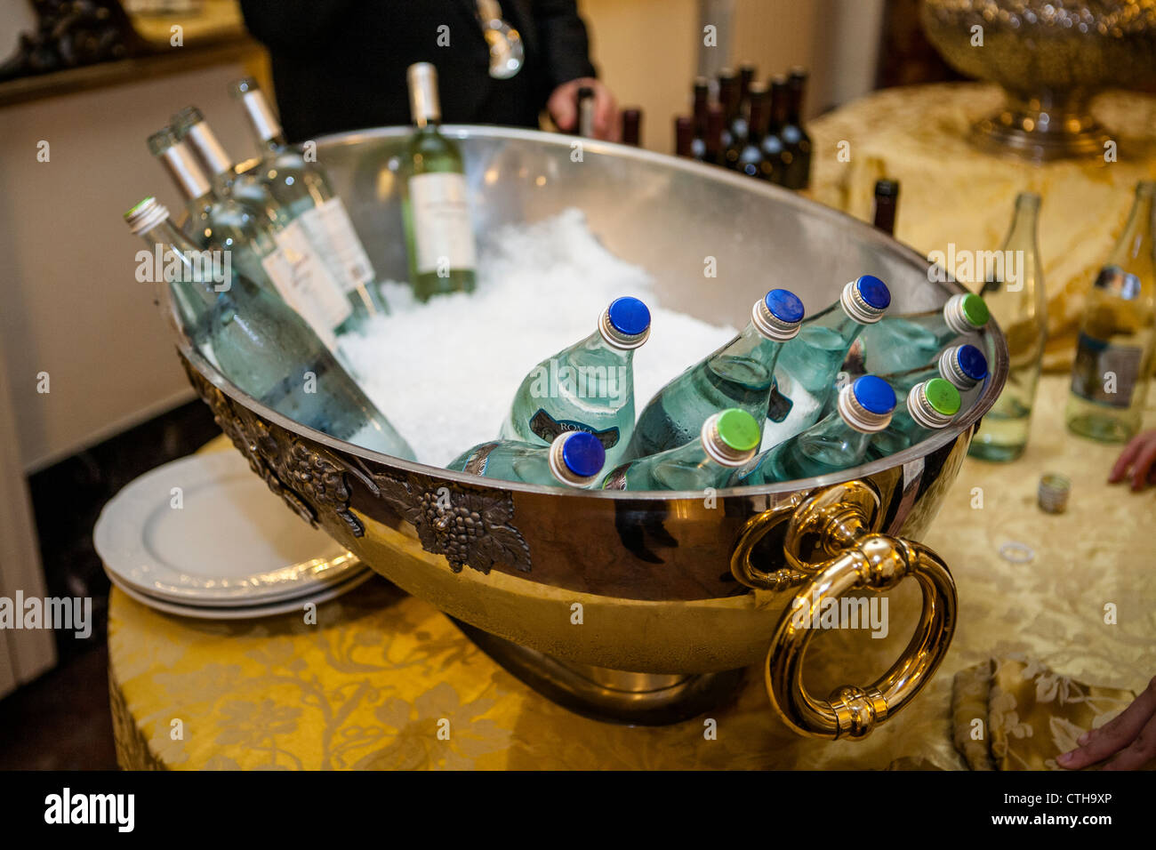 Ornate wine cooler with bottled water and wine Stock Photo