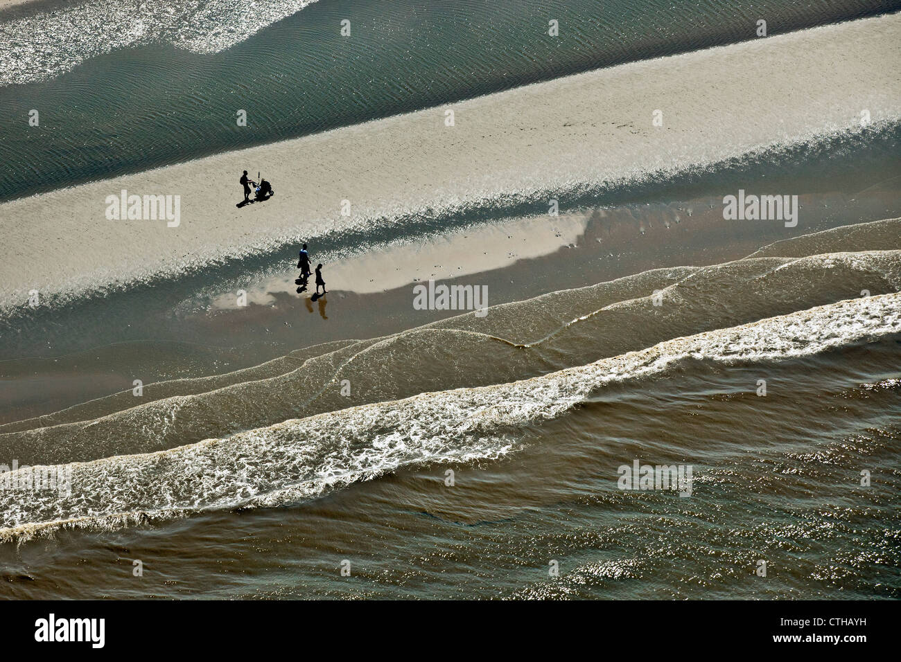 The Netherlands, Noordwijk, People walking on beach. Aerial. Stock Photo