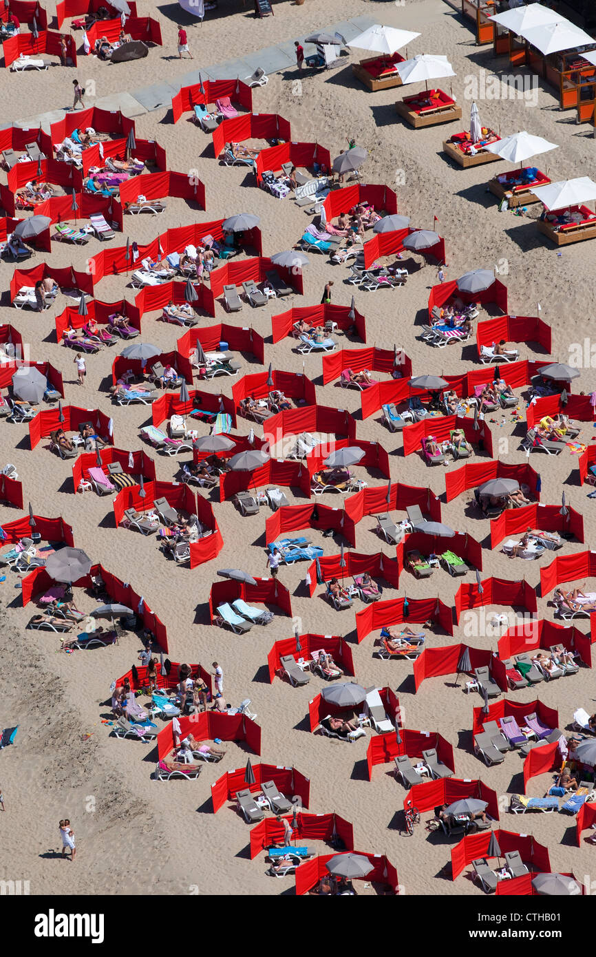 The Netherlands, Noordwijk, People sunbathing on beach. Aerial. Stock Photo