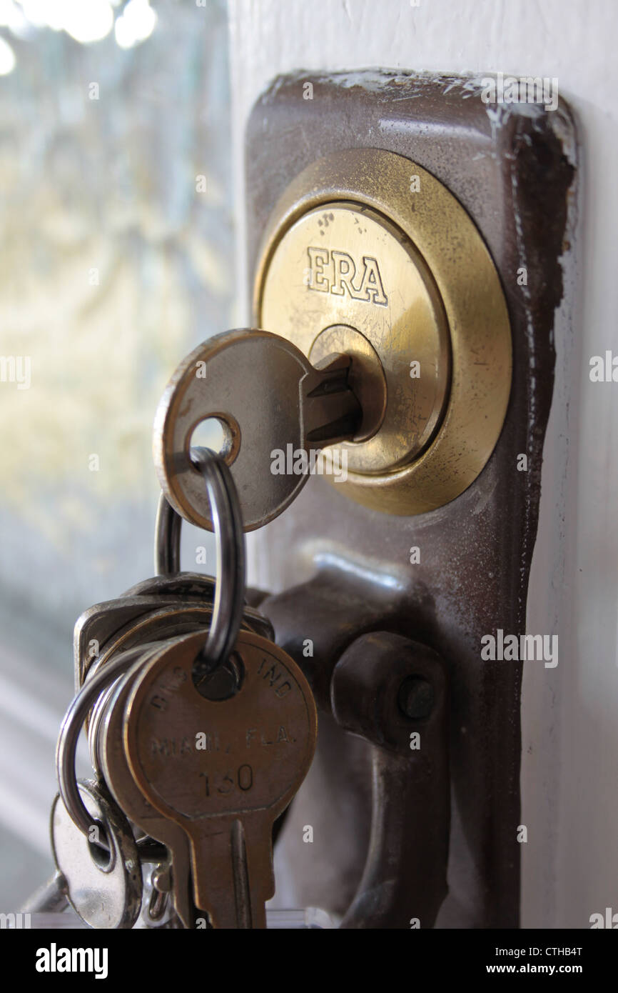 close up of British front door keys in a front door lock Stock Photo