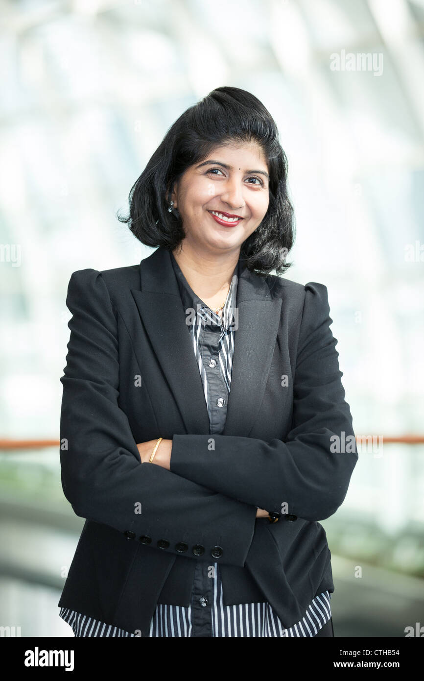 Pretty indian woman arms folded hi-res stock photography and images - Alamy