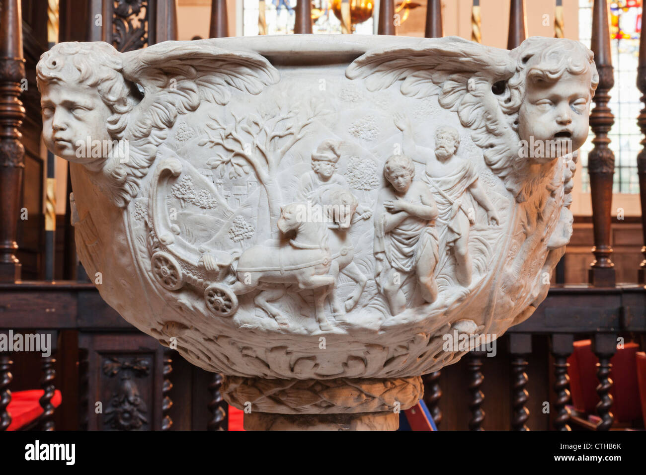 England, London, The City, St.Margaret Lothbury Church, The Font depicting Biblical Scenes and Cherub Heads Stock Photo