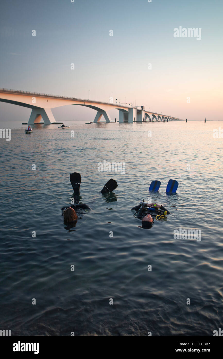 The Netherlands, Zierikzee, bridge called Zeelandbrug. Divers relaxing. Stock Photo