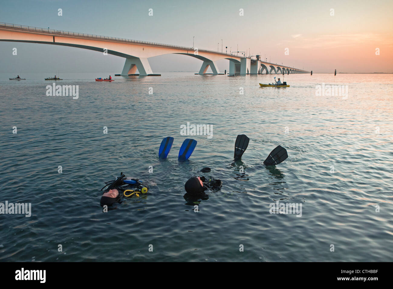 The Netherlands, Zierikzee, bridge called Zeelandbrug. Divers relaxing. Stock Photo