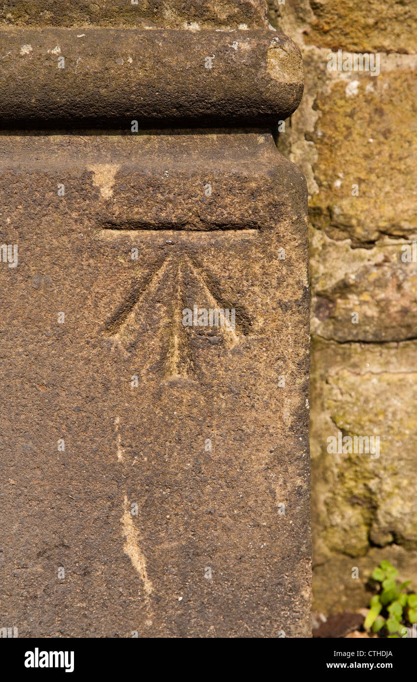 Ordnance Survey surveyors benchmark carved in stone on a wall in