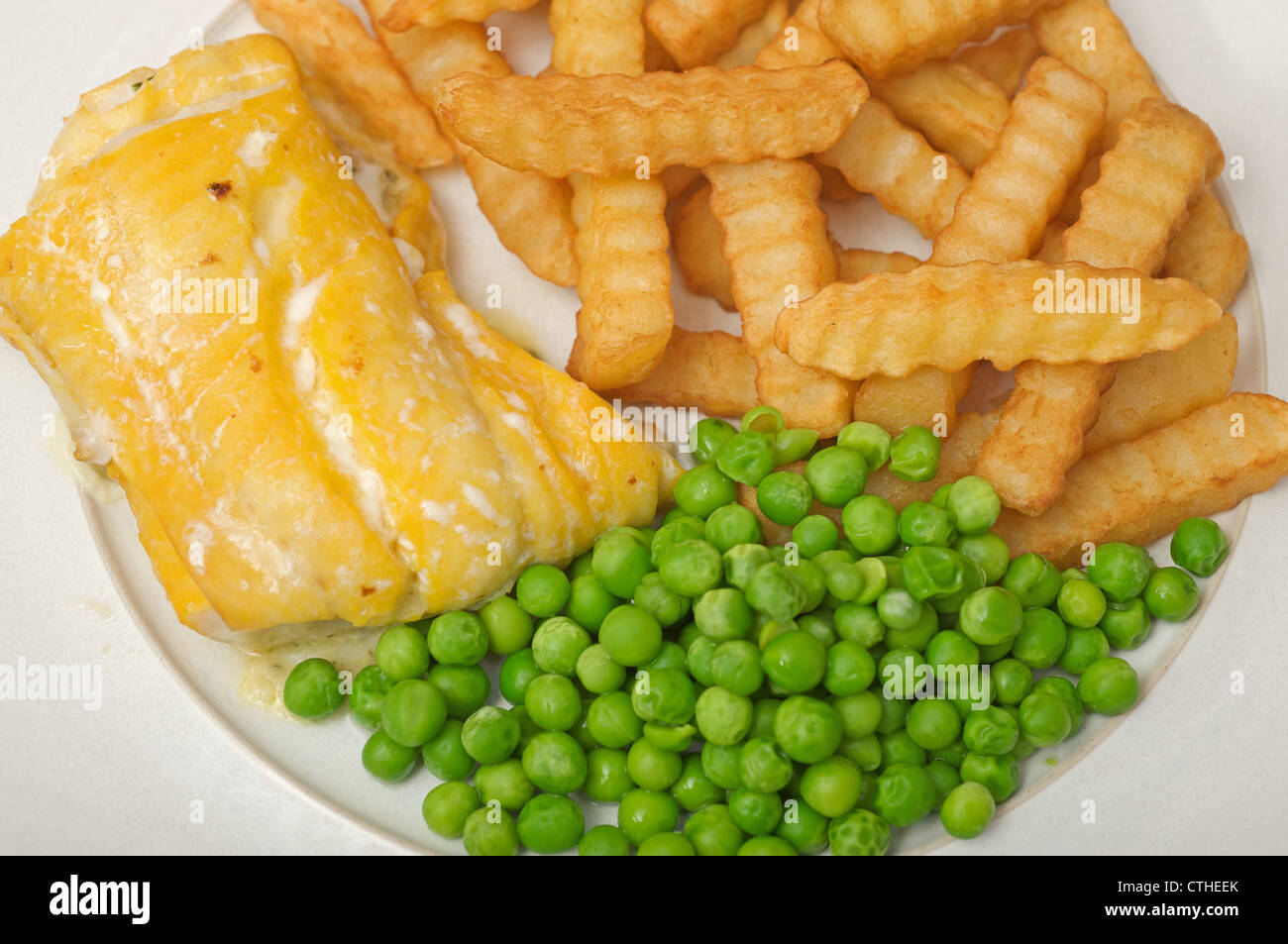 Smoked Haddock, chips and peas Stock Photo Alamy