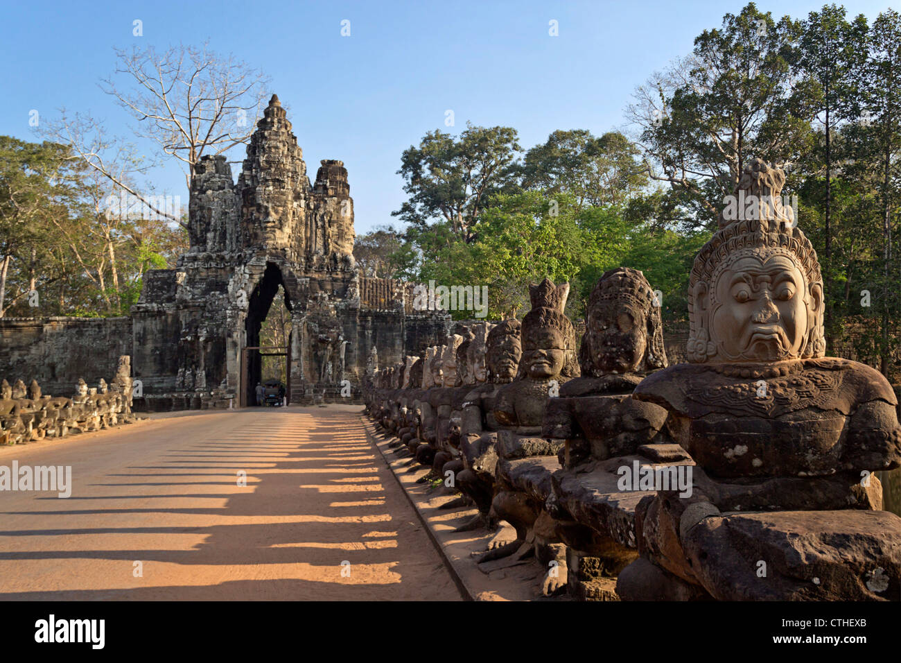 Bridge with sculptures leading to Giant Gopura , south gate of Angkor Thom, Cambodia Stock Photo