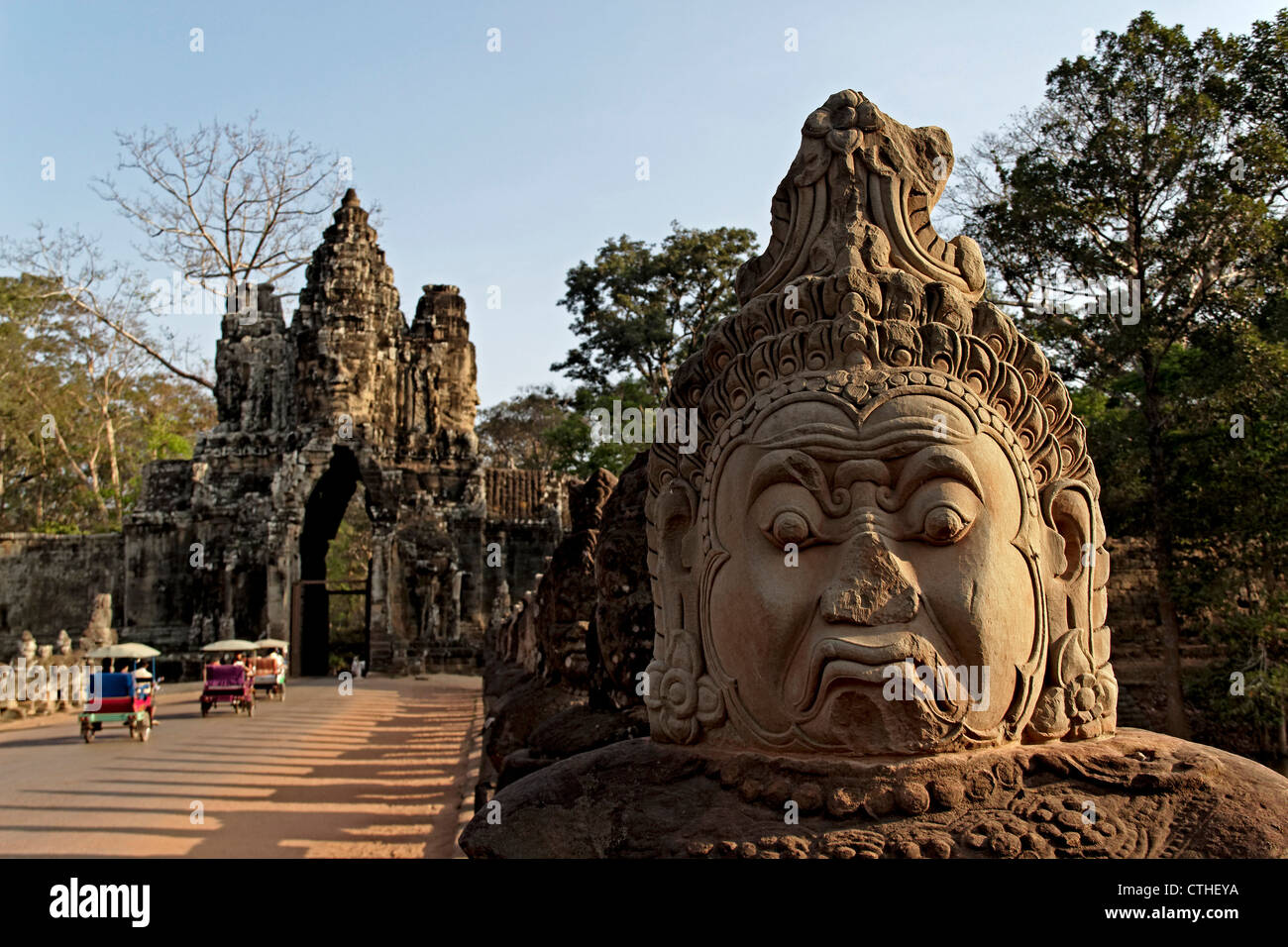 Bridge with sculptures leading to Giant Gopura , south gate of Angkor Thom, Cambodia Stock Photo