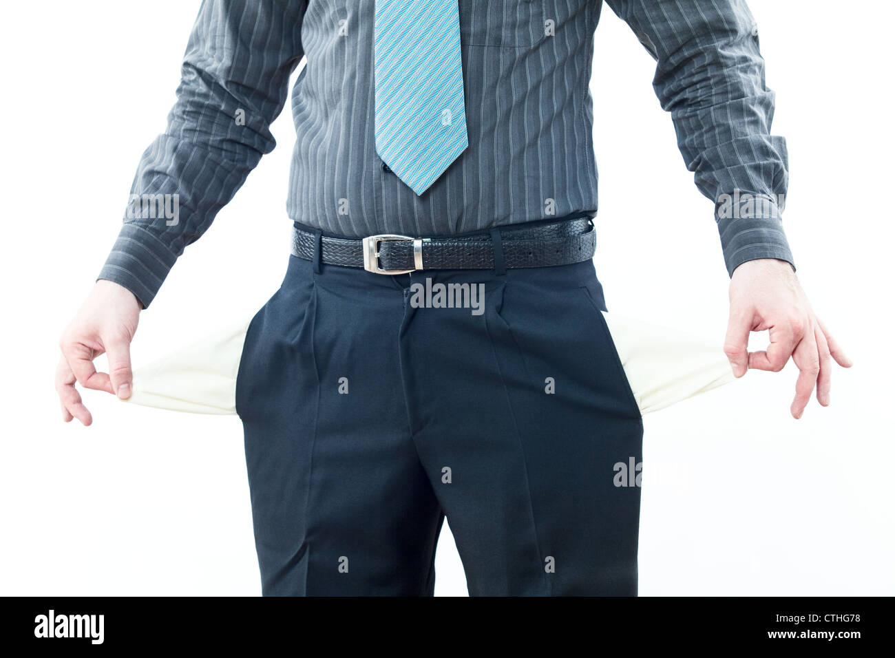 Bankrupt business person with empty pockets Stock Photo