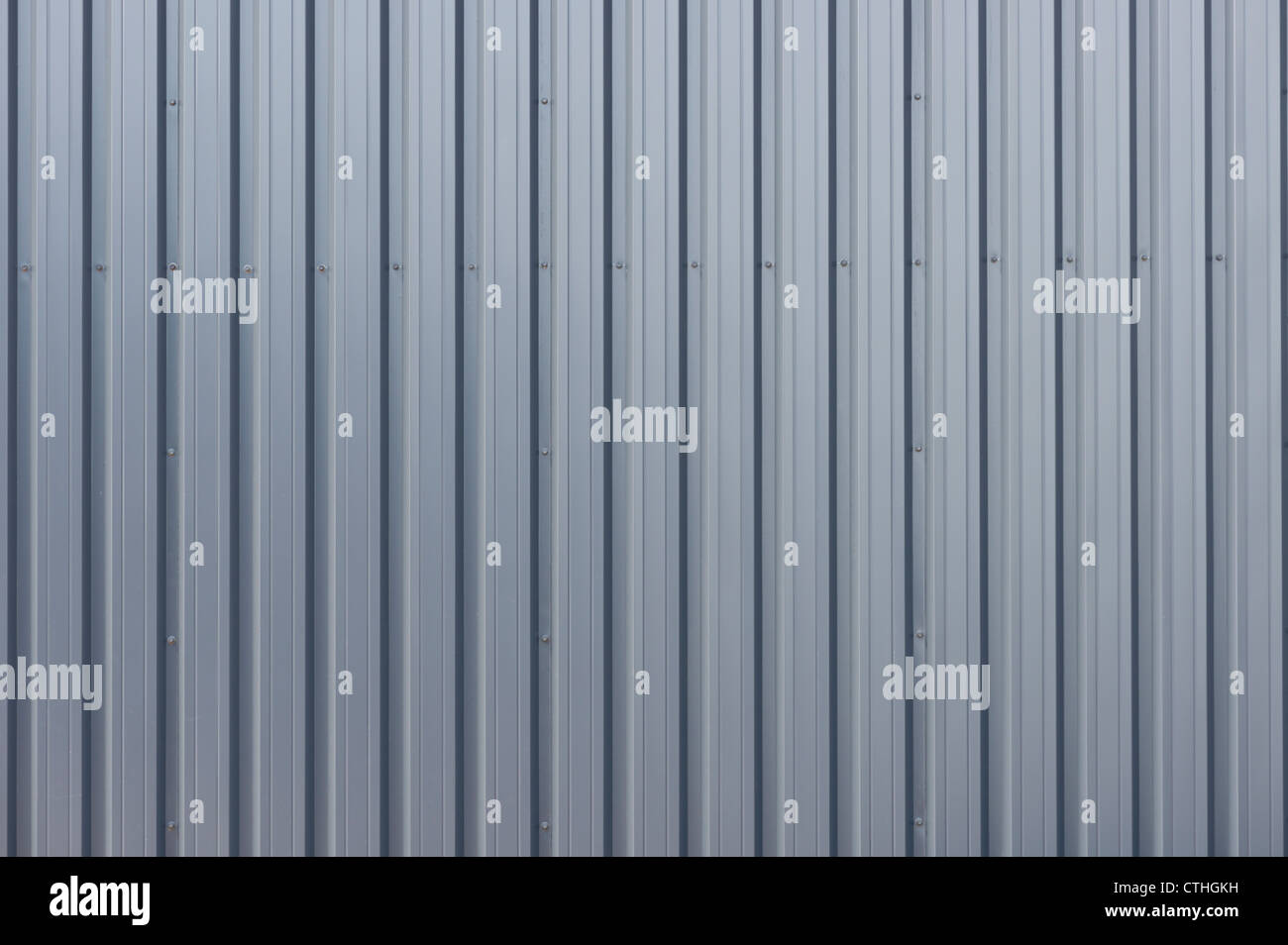 Grey corrugated steel cladding on a industrial building ...