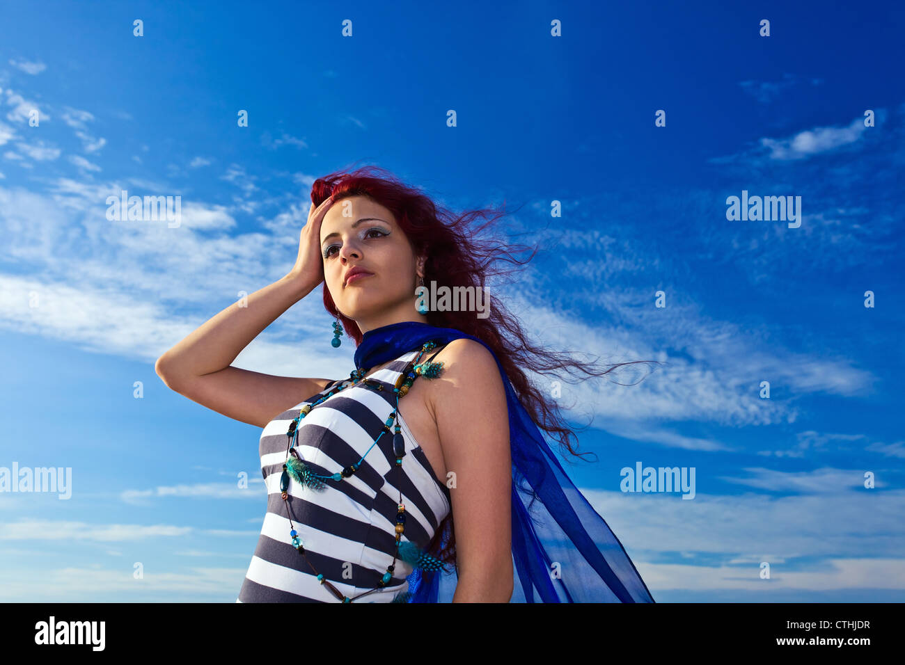 The young beautiful woman in striped dress Stock Photo - Alamy
