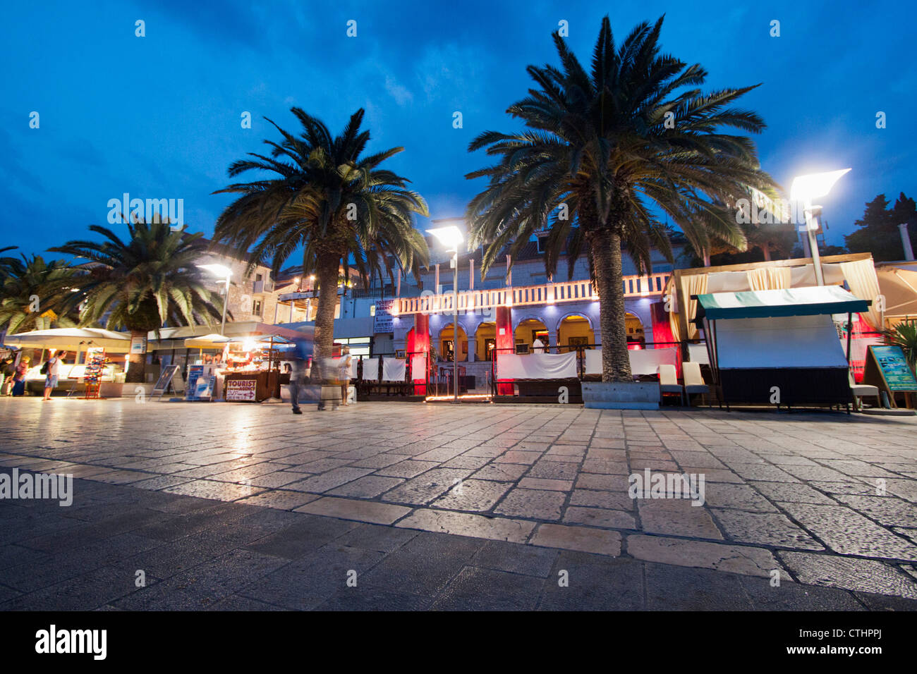 Restaurant and Bar at the Promenade of Hvar at dusk, Croatia Stock Photo