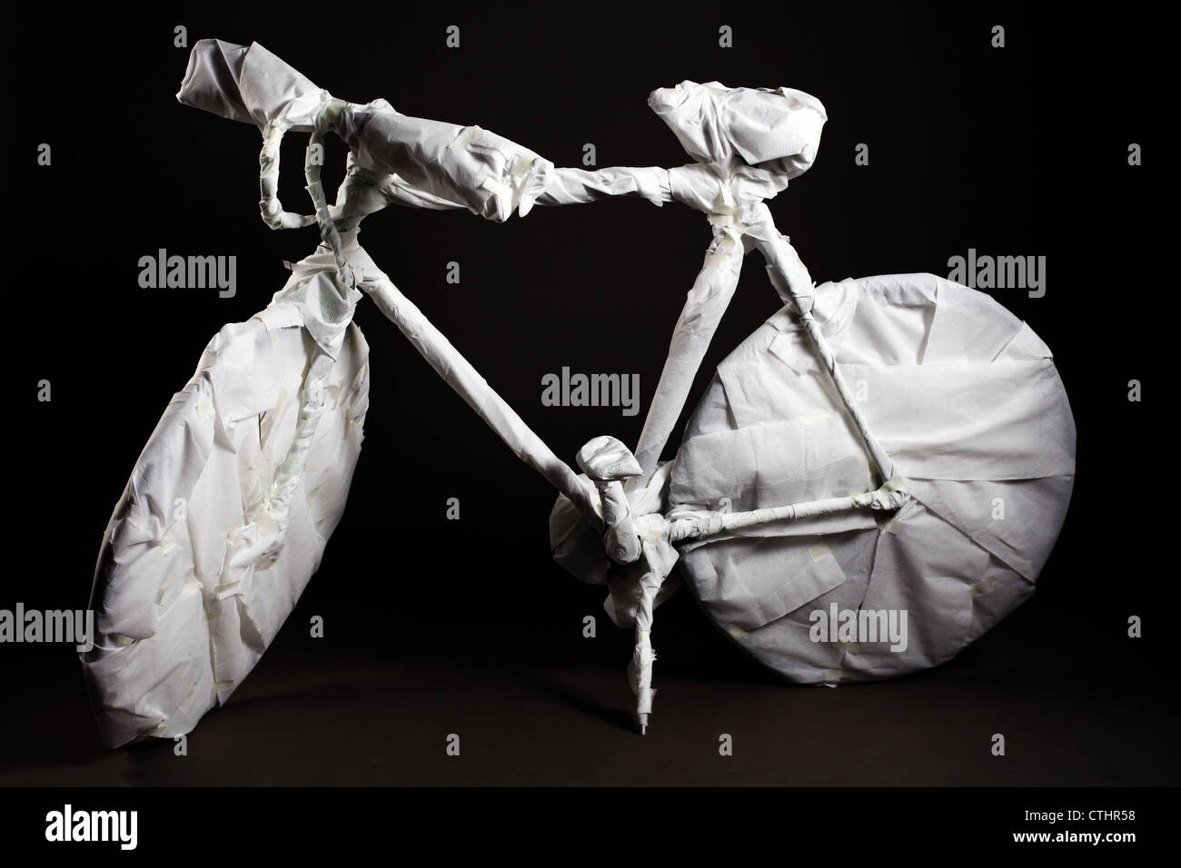 A bicycle covert in paper towels Stock Photo