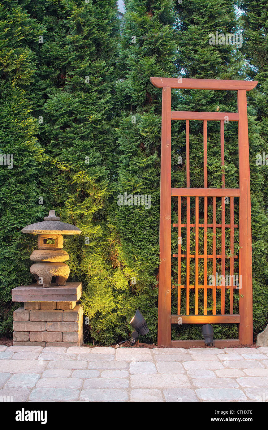 Japanese Stone Pagoda Lantern and Trellis in Backyard Paver Patio Stock Photo Alamy