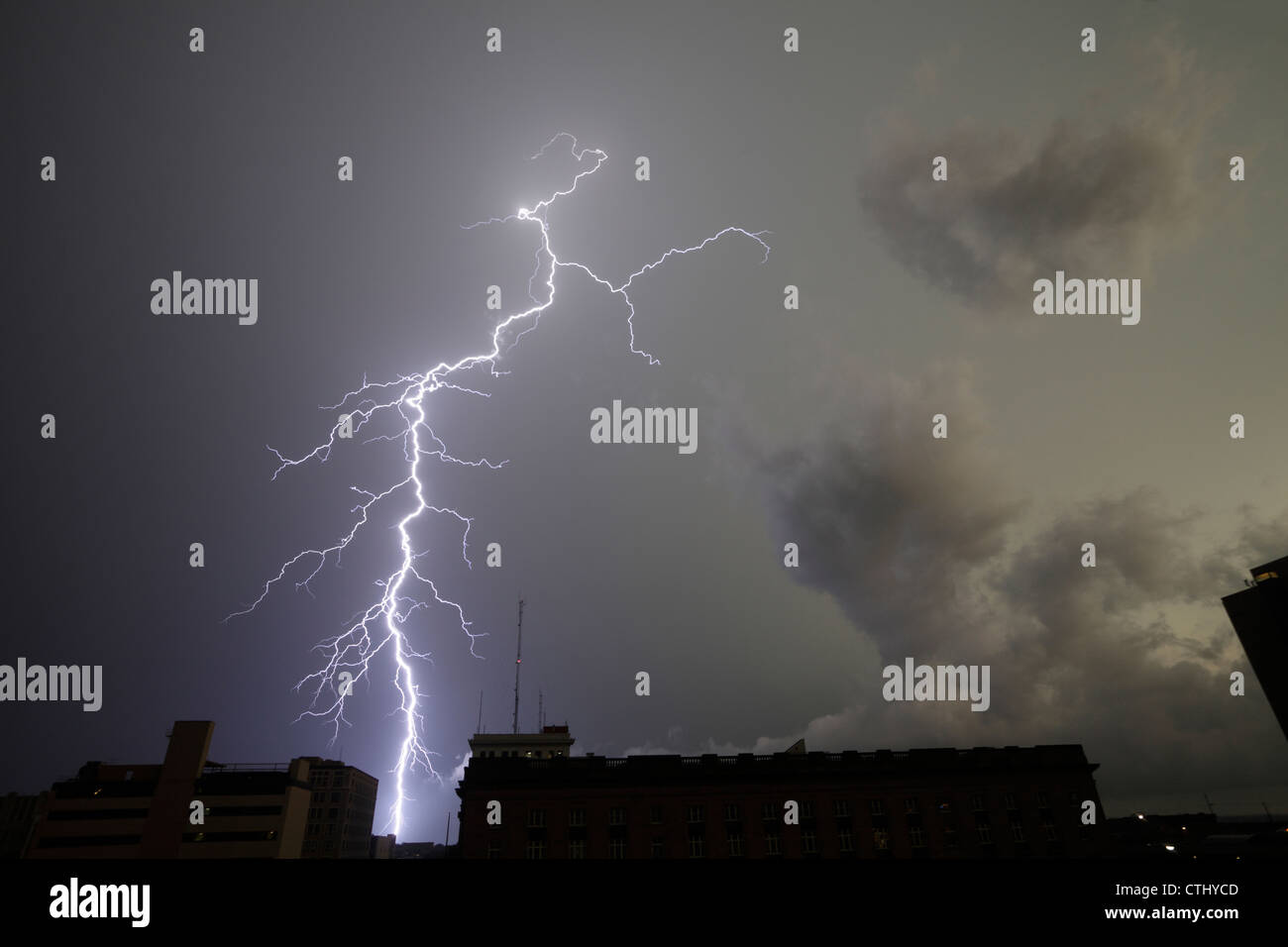 Extremely detailed lightning strike over a city. Stock Photo