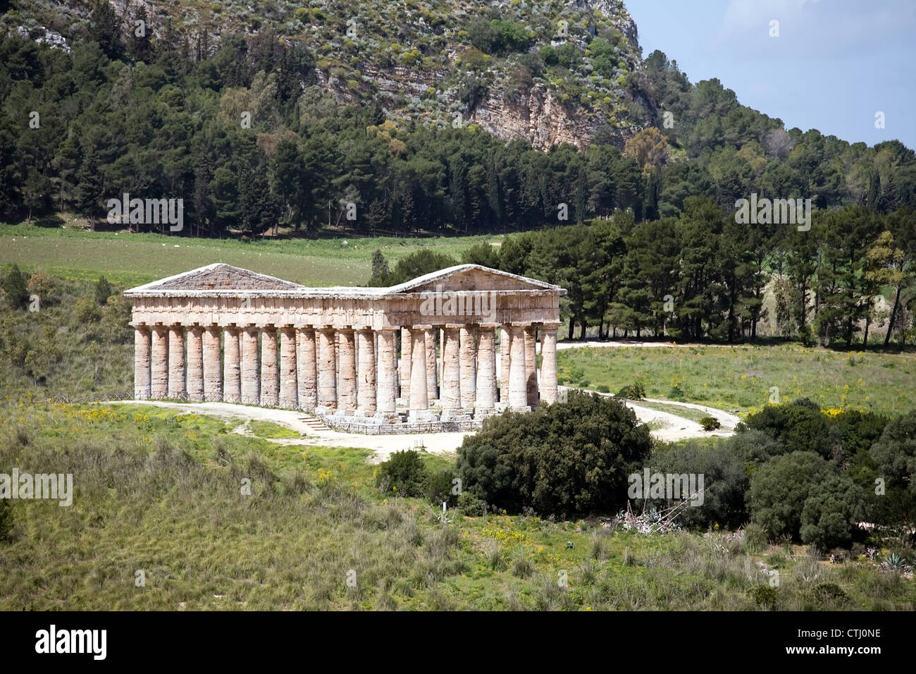 summer landscape with ancient Greek temple of Venus, Segesta village, Sicily, Italy Stock Photo