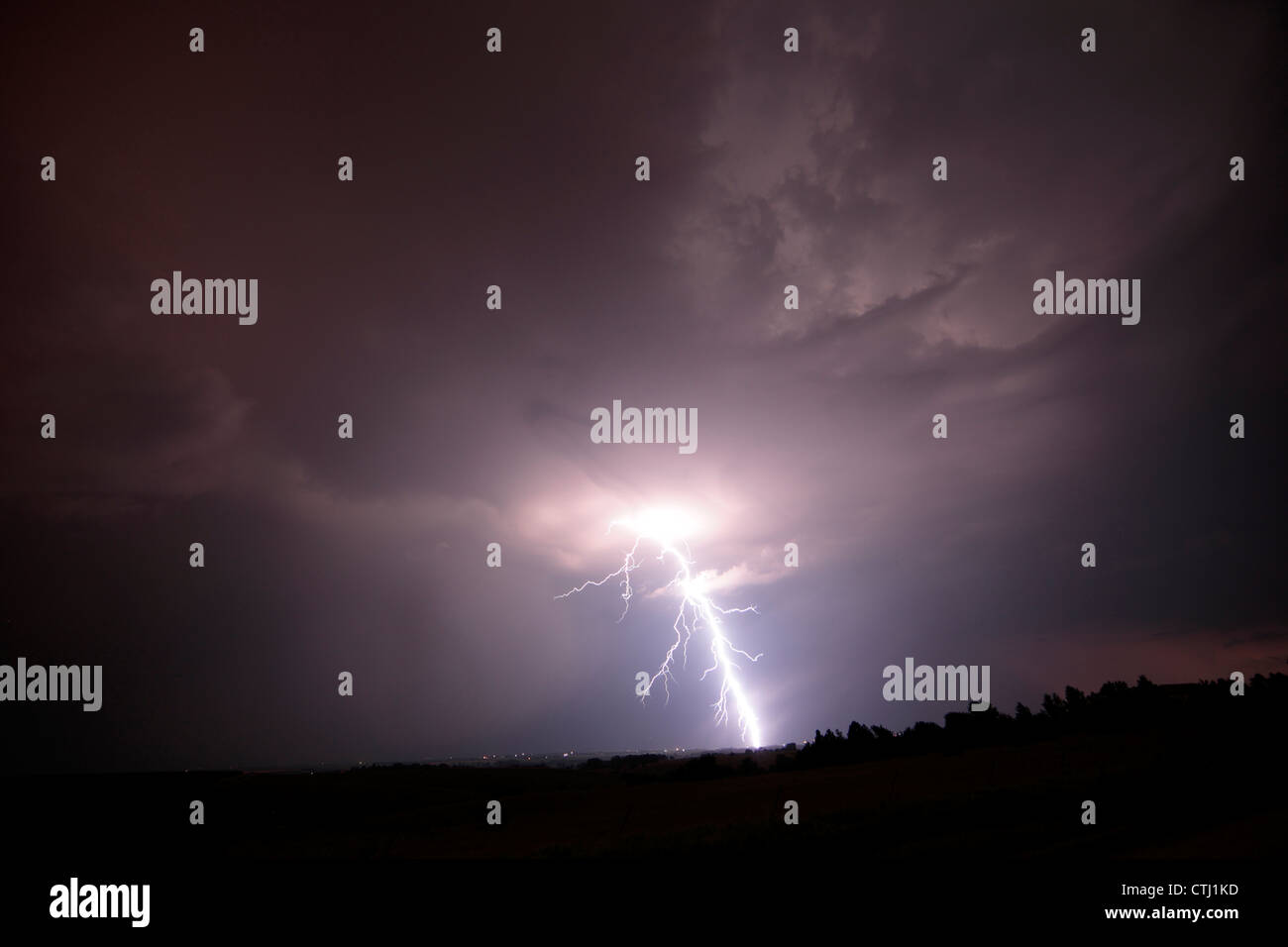 A very detailed bolt of lightning strikes from a night thunderstorm ...