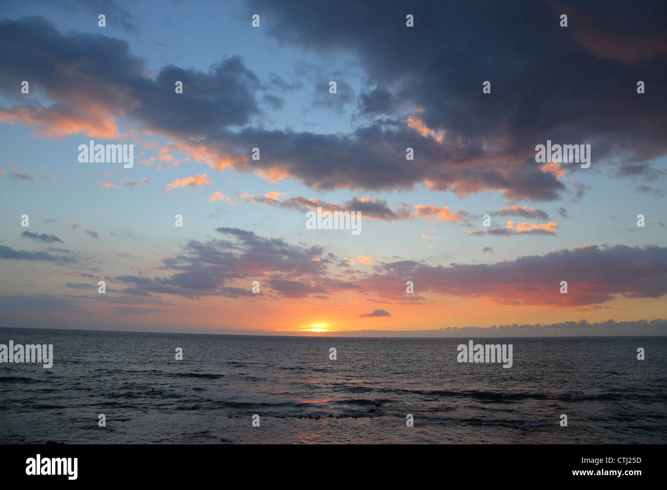 Sunset over Pacific Ocean, Big Island, Hawaii Stock Photo